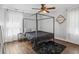 Chic bedroom features a four-poster bed, decorative shelving, and modern lighting at 1599 Ezra Church Nw Dr, Atlanta, GA 30314