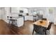 A lovely kitchen offers bright white cabinets, stainless appliances, and a granite bar at 1599 Ezra Church Nw Dr, Atlanta, GA 30314