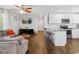 Open concept living space flows into a kitchen with granite countertops and stainless appliances at 1599 Ezra Church Nw Dr, Atlanta, GA 30314