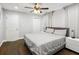 Comfortable main bedroom featuring a ceiling fan, cozy blankets, and natural light at 1599 Ezra Church Nw Dr, Atlanta, GA 30314