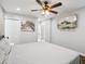 Well-lit bedroom showcases a mounted TV, ceiling fan, and modern decor at 1599 Ezra Church Nw Dr, Atlanta, GA 30314
