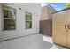 Cozy backyard area with white siding, two windows, storage shed, and a wood fence at 1908 Weston Ln, Tucker, GA 30084
