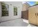 Cozy backyard area with white siding, two windows, storage shed, and a wood fence at 1908 Weston Ln, Tucker, GA 30084