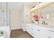 Bright bathroom with a double vanity, granite countertops, and glass-enclosed shower at 1908 Weston Ln, Tucker, GA 30084