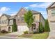 Charming two-story brick home featuring a two-car garage and a beautifully landscaped front yard at 1908 Weston Ln, Tucker, GA 30084