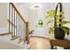 Bright foyer with hardwood floors, wooden staircase, and stylish decor at 1908 Weston Ln, Tucker, GA 30084