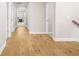 Hallway with hardwood floors and access to multiple rooms, offering a bright and airy feel at 1908 Weston Ln, Tucker, GA 30084