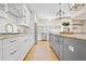 Modern kitchen with granite countertops, stainless appliances, island, and white cabinetry at 1908 Weston Ln, Tucker, GA 30084