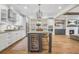 Modern kitchen with wine cooler, granite countertops, stainless appliances, and pendant lighting at 1908 Weston Ln, Tucker, GA 30084