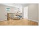 Upstairs landing with hardwood floors, a seating area, and natural light at 1908 Weston Ln, Tucker, GA 30084