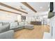 Spacious open-concept living room and kitchen area with hardwood floors and exposed beams at 1908 Weston Ln, Tucker, GA 30084