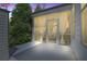 Relax on the screened patio with stylish curtains for added privacy and comfort at dusk at 1908 Weston Ln, Tucker, GA 30084