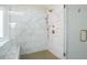 Luxurious tiled shower with glass door and rainfall shower head at 1908 Weston Ln, Tucker, GA 30084