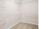 Large walk-in closet with custom shelving and ample storage at 1908 Weston Ln, Tucker, GA 30084