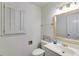 Traditional-style bathroom features a white sink and shuttered window for natural light at 3573 Turtle Cove Se Ct, Marietta, GA 30067