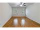 This bedroom features a ceiling fan, natural lighting, and sleek hardwood floors at 3573 Turtle Cove Se Ct, Marietta, GA 30067