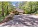 Spacious driveway leading to a garage, with meticulously maintained landscaping enhancing curb appeal at 3573 Turtle Cove Se Ct, Marietta, GA 30067