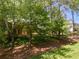 Beautiful brick home with manicured landscaping and mature trees enhancing curb appeal at 3573 Turtle Cove Se Ct, Marietta, GA 30067