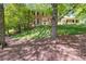 Brick home nestled in a wooded setting, offering privacy and curb appeal at 3573 Turtle Cove Se Ct, Marietta, GA 30067