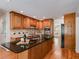A view of the kitchen features granite countertops, custom cabinets, and hardwood floors at 3573 Turtle Cove Se Ct, Marietta, GA 30067