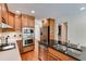 Well-appointed kitchen with stainless steel appliances, dark countertops, and rich wood cabinetry at 3573 Turtle Cove Se Ct, Marietta, GA 30067