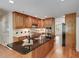 Beautiful kitchen featuring wood cabinets, a dark countertop island, and stainless steel appliances at 3573 Turtle Cove Se Ct, Marietta, GA 30067