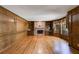 Spacious living room with hardwood floors, brick fireplace and custom wood paneling at 3573 Turtle Cove Se Ct, Marietta, GA 30067