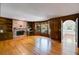 Bright living room features hardwood floors, brick fireplace and custom wood paneling at 3573 Turtle Cove Se Ct, Marietta, GA 30067