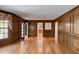 Expansive living room boasts hardwood floors, custom wood paneling and natural light at 3573 Turtle Cove Se Ct, Marietta, GA 30067
