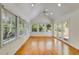 Spacious sunroom with vaulted ceilings, multiple windows, and access to the outdoor patio at 3573 Turtle Cove Se Ct, Marietta, GA 30067