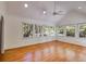 Sunroom featuring vaulted ceilings, natural light, hardwood floors, and access to other rooms at 3573 Turtle Cove Se Ct, Marietta, GA 30067