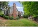 Beautiful backyard with a playhouse and well-manicured landscaping at 492 Conway Manor Nw Dr, Atlanta, GA 30327