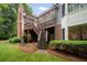 Backyard patio with well-kept landscaping and a staircase at 492 Conway Manor Nw Dr, Atlanta, GA 30327