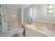 Cozy bathroom with a combined tub and shower with unique light fixture at 492 Conway Manor Nw Dr, Atlanta, GA 30327