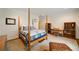 Inviting bedroom boasts a four-poster bed and a well-lit desk area with built-in bookcases at 492 Conway Manor Nw Dr, Atlanta, GA 30327
