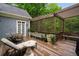 Enjoy outdoor living on this deck featuring a pergola, seating, and a garden area at 492 Conway Manor Nw Dr, Atlanta, GA 30327