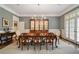 Dining room with hardwood floors, statement chandelier, and a classic china cabinet at 492 Conway Manor Nw Dr, Atlanta, GA 30327