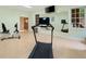 Bright exercise room with wall mirror and a variety of equipment at 492 Conway Manor Nw Dr, Atlanta, GA 30327