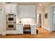 Bright kitchen features stainless steel appliances, a desk, and custom cabinets for a classic and functional space at 492 Conway Manor Nw Dr, Atlanta, GA 30327