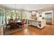 Bright eat in kitchen features a large center island, stainless steel appliances, and a dining area with great light at 492 Conway Manor Nw Dr, Atlanta, GA 30327