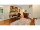 Office with built-in shelving, a wooden desk, and hardwood floors at 492 Conway Manor Nw Dr, Atlanta, GA 30327