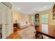 Office with built-in shelving, a comfortable sofa, and a wooden desk on hardwood floors at 492 Conway Manor Nw Dr, Atlanta, GA 30327