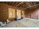 Covered patio area features exposed ceiling and access to landscaped backyard at 492 Conway Manor Nw Dr, Atlanta, GA 30327