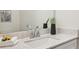 Bathroom vanity featuring a white marble countertop and chrome faucet at 1095 Tucker Ave # 207, Atlanta, GA 30310