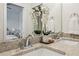 Bathroom vanity featuring double sinks, chrome faucets, and a large mirror at 1095 Tucker Ave # 207, Atlanta, GA 30310