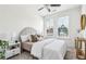 Cozy bedroom with neutral tones, large windows, and ample natural light at 1095 Tucker Ave # 207, Atlanta, GA 30310