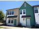 Charming townhomes showcasing modern architecture with colorful siding and well-manicured landscaping at 1095 Tucker Ave # 207, Atlanta, GA 30310