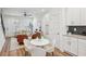 Cozy living room featuring an eat-in kitchen, comfortable seating, and lots of natural light at 1095 Tucker Ave # 207, Atlanta, GA 30310