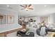 Open-concept living area with modern decor, seamlessly connecting to the kitchen and dining area at 126 Kenney Way, Locust Grove, GA 30248