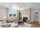 Inviting living room with fireplace, neutral tones, and comfortable seating, creating a cozy atmosphere at 126 Kenney Way, Locust Grove, GA 30248